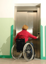 Lady in wheelchair using passenger lift